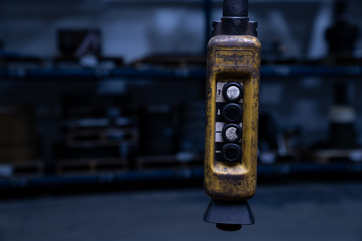 Handheld industrial control system on workshop floor