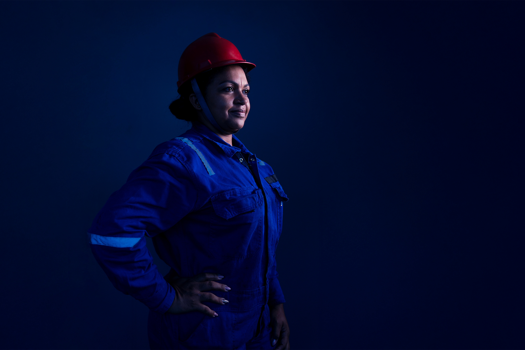 Worker in PPE photographed under low light conditions