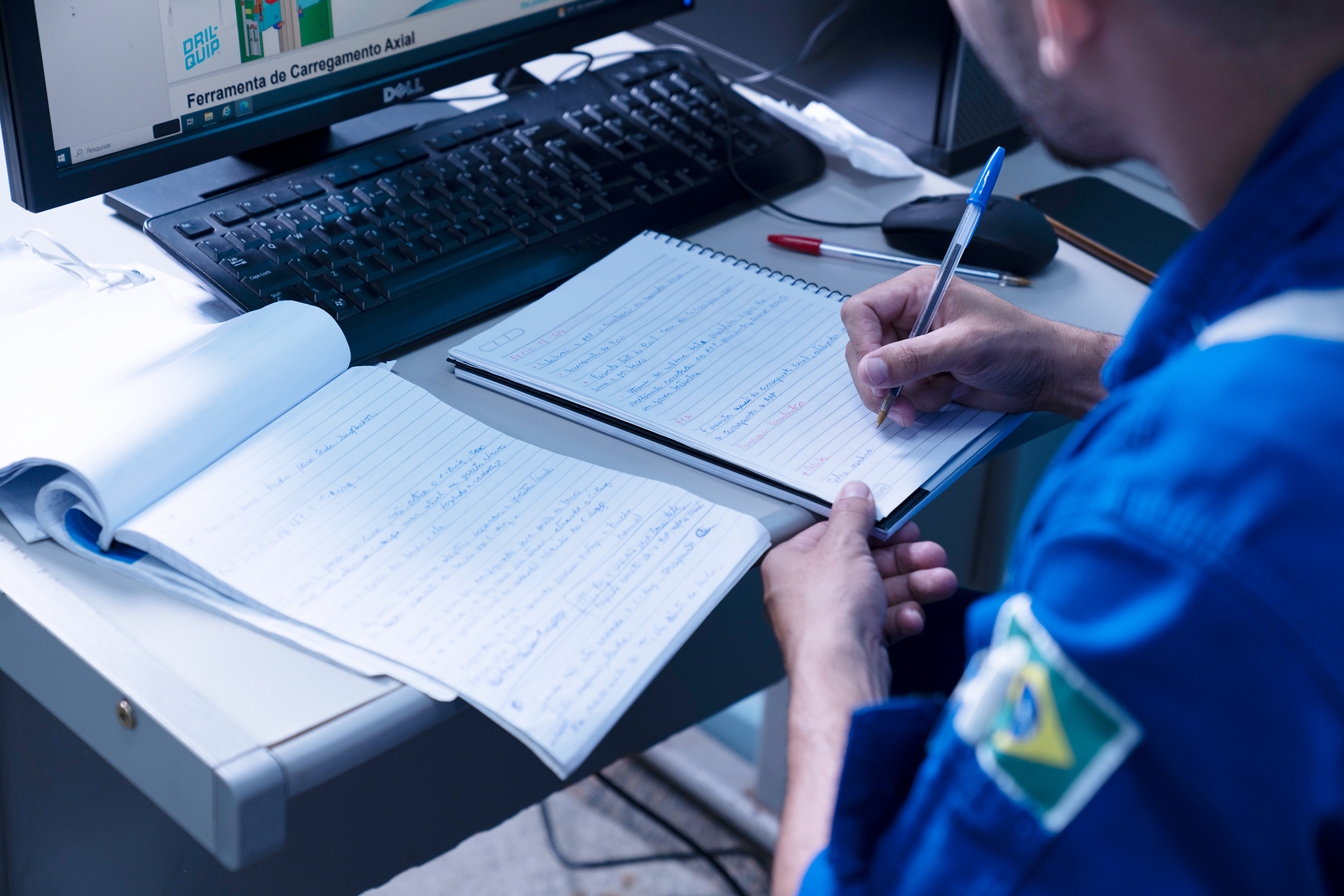 Technician reviewing engineering documentation