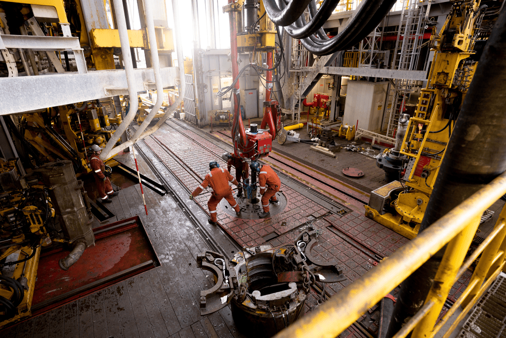 industrial photographer Offshore rig drill deck activity as technicians prepare drilling equipment